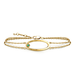 Браслет декоративный из желтого золота с изумрудом